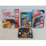 Four boxed die-cast Secret Agent related guns etc.