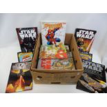 A box of mainly toy guide books including by Ramsey, Star Wars annuals etc.