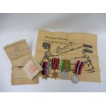 A group of WWII medals awarded to Harold Bindon with grade card etc. plus a swagger stick.