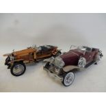 Two Franklin Mint scale models of a 1921 Rolls-Royce Silver Ghost and a 1930 Duesenberg.