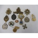 A group of military badges including two commemorating WWI battles, 1914-1916 including The Somme.