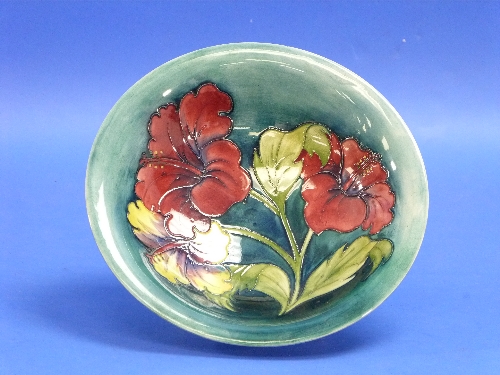 A Walter Moorcroft 'Hibiscus' pattern Bowl, impressed marks, initialled in blue, 9?in (25cm)