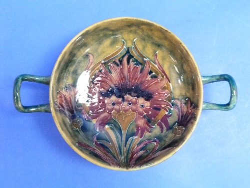 A William Moorcroft cornflower design two handled Bowl, the interior with red flowers and mottled