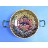 A William Moorcroft cornflower design two handled Bowl, the interior with red flowers and mottled