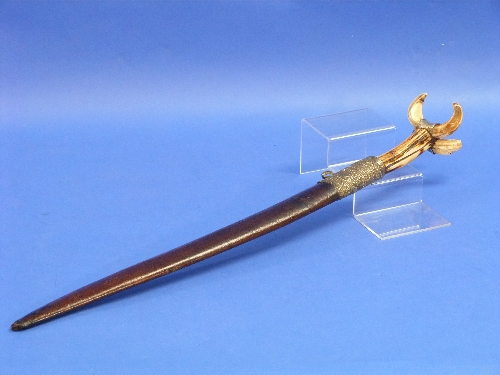 A 19th century Turkish Yatagan, the 20in (51cm) long blade engraved with Arabic inscription, horn