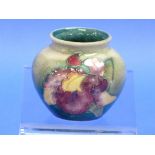 A Moorcroft 'Orchid' pattern Vase, of small globular form, impressed marks, 2½in (6.5cm) high.