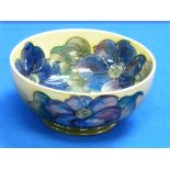 A Walter Moorcroft green/yellow groud Bowl, decorated in the 'Clematis' pattern, impressed mark,