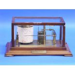 A vintage Barograph, of traditional form, with six vacuum sections and brass frame, in mahogany case