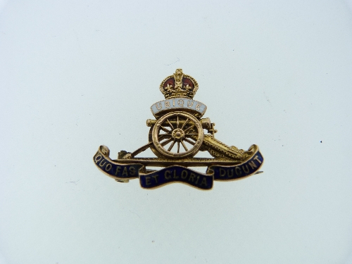 A 9ct yellow gold and enamel Royal Artillery Regimental Crest Brooch.