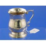 An Elizabeth II silver Mug, hallmarked Birmingham, 1967, of plain baluster form with stepped