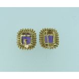 A pair of amethyst and diamond Ear Clips, of rectangular form, the facetted central stone surrounded