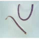 A 14k yellow gold and amethyst Necklace and Bracelet, formed of flexible rows of amethyst and