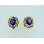 A pair of harlequin oval Earrings, the centre set with facetted amethyst and with peridot, topaz,