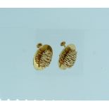 An amusing pair of 14k yellow gold Earrings, with screw fittings, formed of an oval plate with a