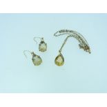 A teardrop citrine Pendant and trace chain, and pair of citrine pendant earrings, all mounted in 9ct