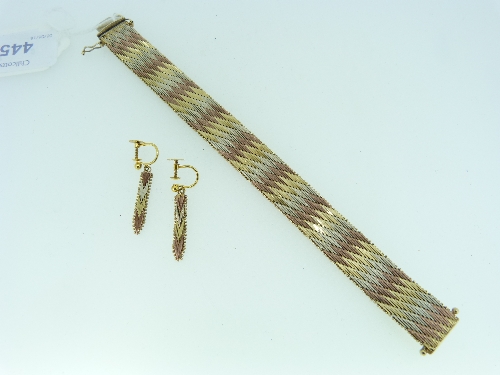 A 9kt tri-colour gold flexible Bracelet, formed of five diagonal rows of yellow, rose and white