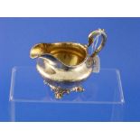 A Victorian silver Cream Jug, by Barnards, hallmarked London, 1847, of circular form with scroll
