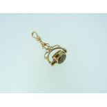 A 9ct yellow gold Swivel Seal / Fob, the seal set with grey striated agate, Tigers Eye and