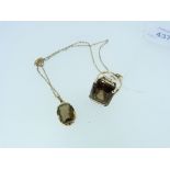A smokey quartz Ring, with corresponding pendant on trace chain, the ring set with large rectangular