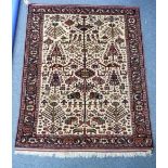 Tribal rugs; a fine Quashqai rug, cream ground profusely woven with stylised Tree of Life, camel,