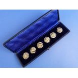 A cased set of six Continental silver Buttons, with import marks for Samuel Jacob, London, 1910,