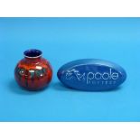 A Poole Pottery Shop Advertising Display Piece, oval blue with dolphin, 7¼in (18.5cm) wide, and a