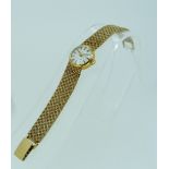 A 9ct gold Eterna-Matic Golden Heart lady's Wristwatch, the silvered dial with gilt baton markers