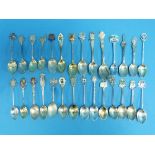 A collection of silver Souvenir Spoons, approx 24, including Houses of Parliament, Empire Exhibition