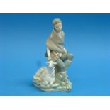 A Lladro group of Little Shepherd Boy with Goat, on shaped base with rocky outcrop, 9¼in (23.5cm)