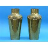 A pair of Arts & Crafts hammered brass Vases, the shoulders repoussé decorated with stylised