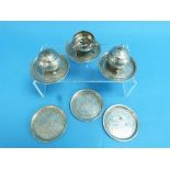 A set of six Persian silver Coasters, decorated in the Eastern style with a foliate geometric