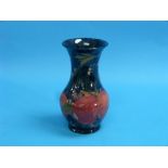 A William Moorcroft 'Pomegranate' pattern Vase, blue ground, of baluster form, green painted