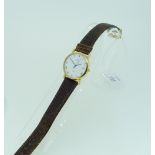 A gentleman's 18ct gold Omega De Ville Wristwatch, with quartz movement, the white dial with black