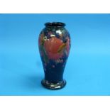 A William Moorcroft 'Pomegranate' pattern Vase, of baluster form, green painted signature, impressed