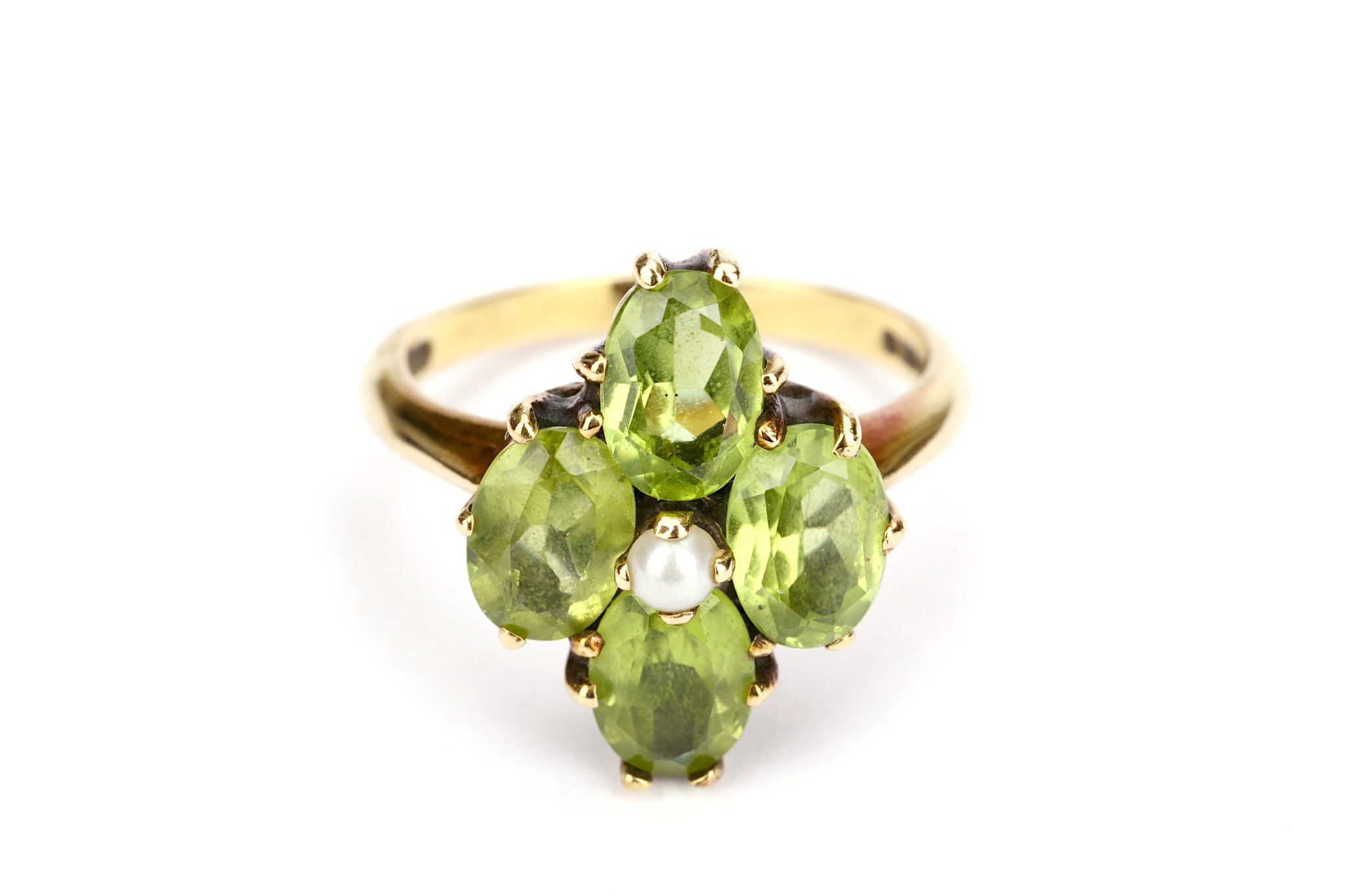 A peridot cluster ring, With half-pearl centre, mounted in 9ct gold, UK hallmark, ring size L