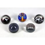 A collection of five Scottish Caithness glass paperweights, circa 1980, comprising two from the '