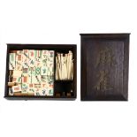 A Chinese bone and bamboo Mahjong set, in a darkwood case