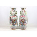 A large pair of Canton porcelain Famille Rose twin-handled baluster vases, late 19th century,