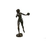 An bronze figure of a female nude, early 20th century, modelled dancing with a tambourine, signed