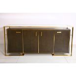 A Finchatton brass and wood sideboard with four cupboard doors, 180 x 45cm.