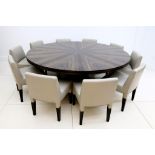 A set of ten short side dining chairs by Promemoria in a grey leather .