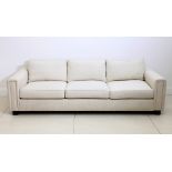 A pair of large Finchatton light cream linen upholstered, three seater sofas, 253 x 99cm (2).