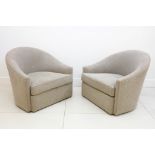 A pair of Finchatton grey upholstered tub armchairs on swivel bases (2).