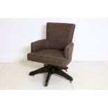 A Finchatton tub desk chair, with brown leather piped upholstery, on swivel base.