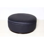 A Finchatton circular pouffe, in dark grey upholstery, 100cm diameter.