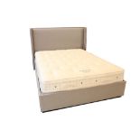 A king size Vispring Regal Superb double bed, mattress and grey upholstered headboard.