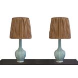 A pair of large celadon crackle-glaze ceramic table lamps, manufactured by Porta Romana, with