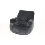 A Poliform grey upholstered easy armchair.