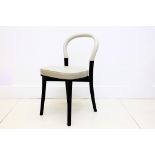 A Cassina white leather and ebonised dressing table chair.