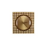Jeager-LeCoultre. A gilt metal mystery dial boudoir strut alarm clock. Date: Circa 1970. Movement: